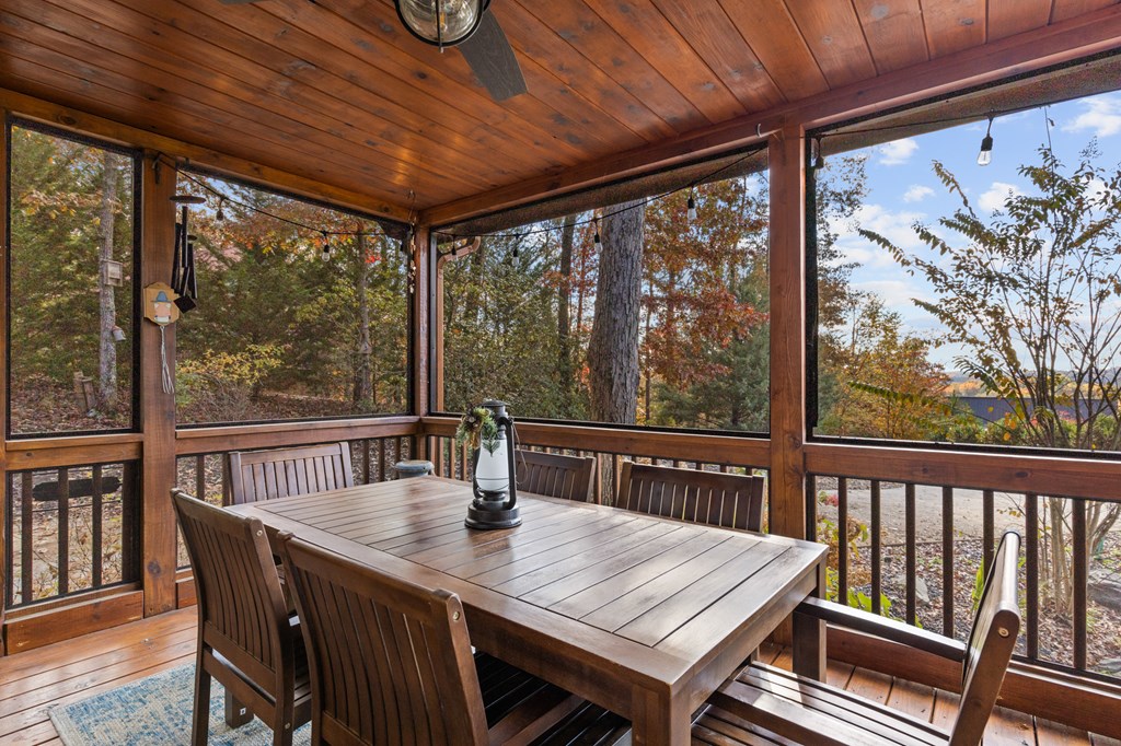 653 The Woods Road Mineral Bluff, GA 30559 - Photo 29 of 56 a view of a dining room with furniture window and outside view