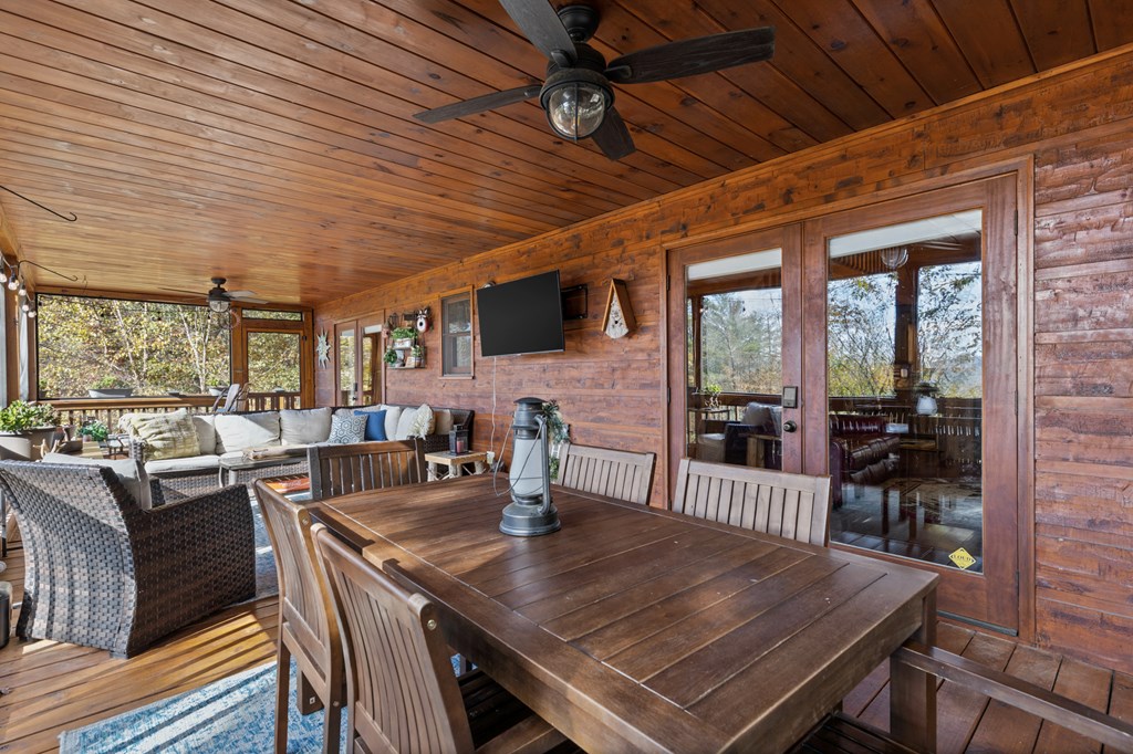653 The Woods Road Mineral Bluff, GA 30559 - Photo 31 of 56 a view of a dining room with furniture window and outside view