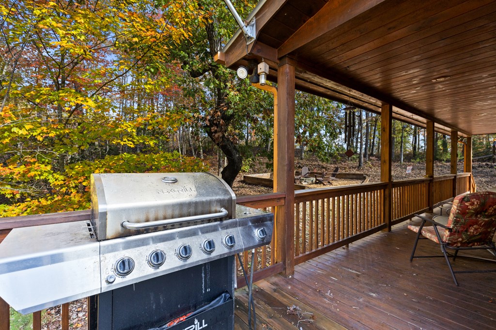 653 The Woods Road Mineral Bluff, GA 30559 - Photo 36 of 56 a view of a balcony with chairs
