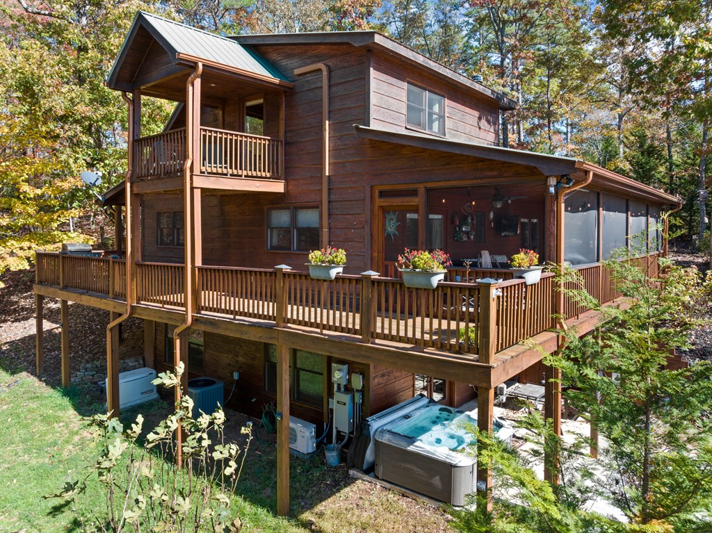 653 The Woods Road Mineral Bluff, GA 30559 - Photo 8 of 56 front view of a house with a small yard