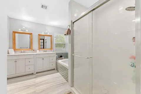 an aerial view of a house with a garden and trees