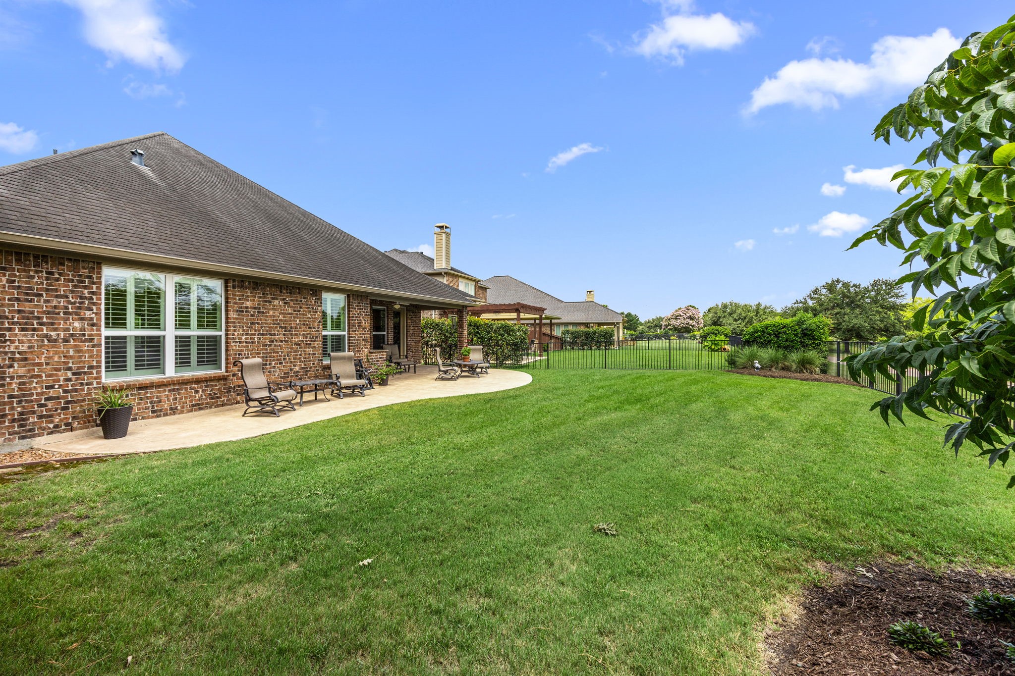 27642 Linden Ridge Lane Fulshear, TX 77441 - Photo 31 of 42 This view is looking north and captures the surrounding natural setting, showcasing the home’s peaceful environment and scenic backdrop.