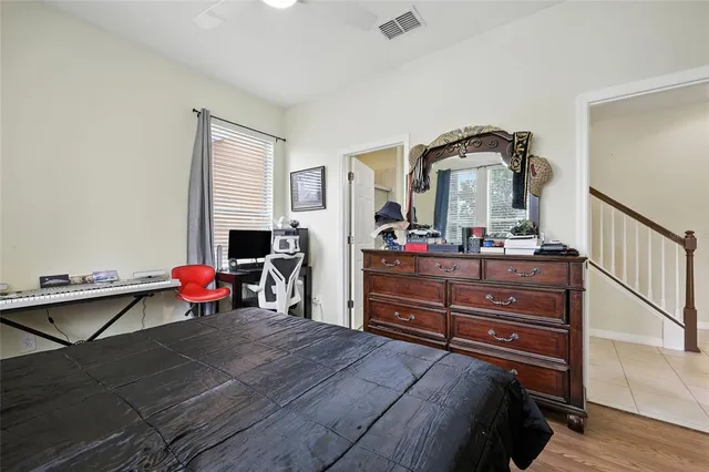 a bathroom with a sink a toilet a mirror and shower