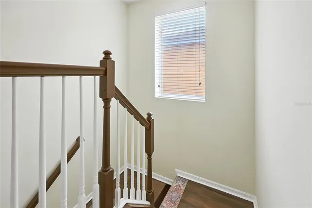 a view of a livingroom with furniture and hardwood floor