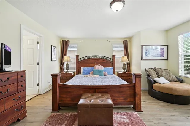 a bathroom with a shower sink double mirror and shower