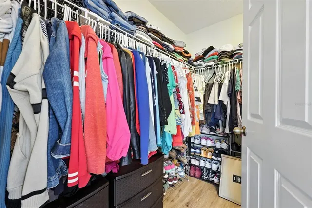 a bathroom with a granite countertop sink a toilet and a mirror