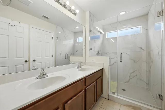 a white toilet sitting next to a white wall