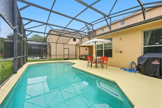 a view of a swimming pool with a patio