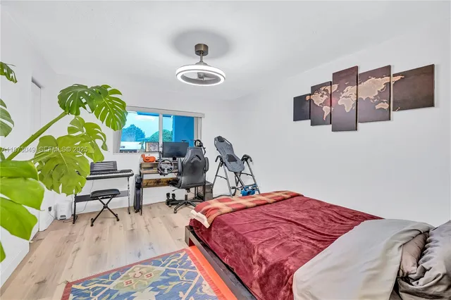 a bed room with a bed and a chair