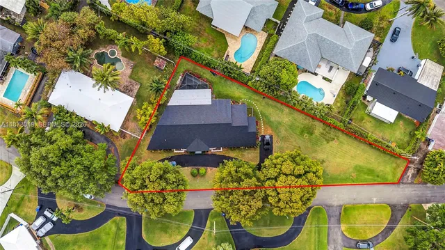 an aerial view of a house with swimming pool