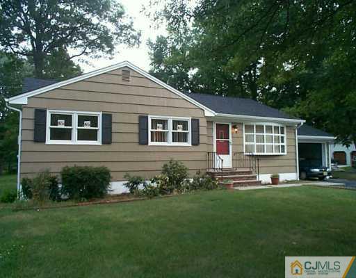 833 Inman Avenue Edison, NJ 08820 - Photo 1 of 8 a front view of a house with a yard