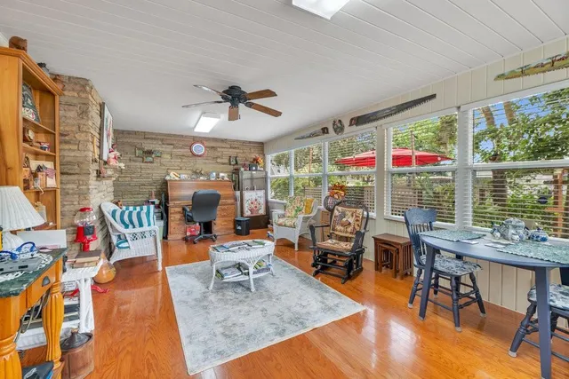 a living room filled with furniture and a chandelier