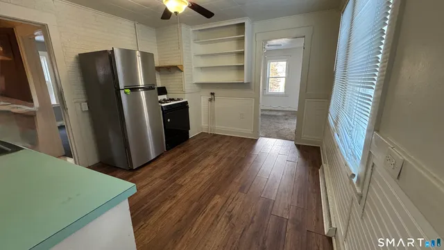 a view of a livingroom with wooden floor