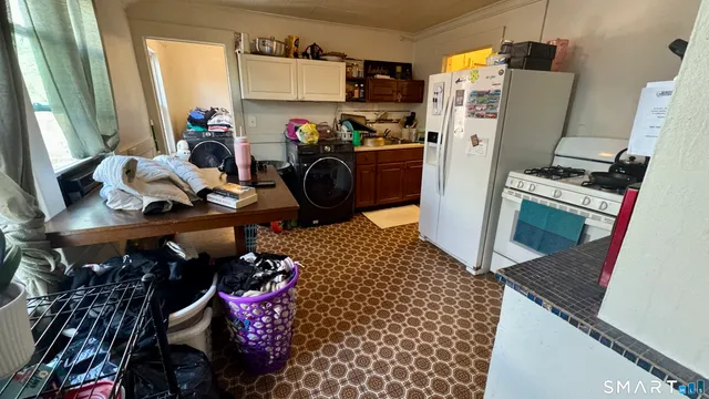 a living room with a couch and a bookshelf