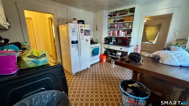 a view of living room with furniture and a window