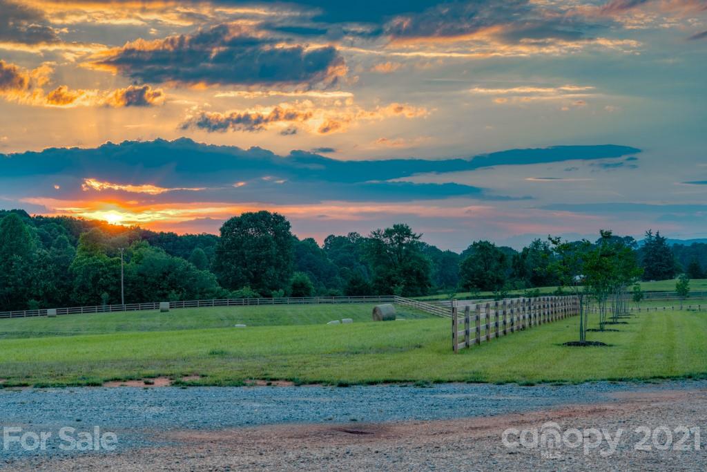 2380 New House Road Ellenboro, NC 28040 - Photo 16 of 44 a view of a golf course with a lake