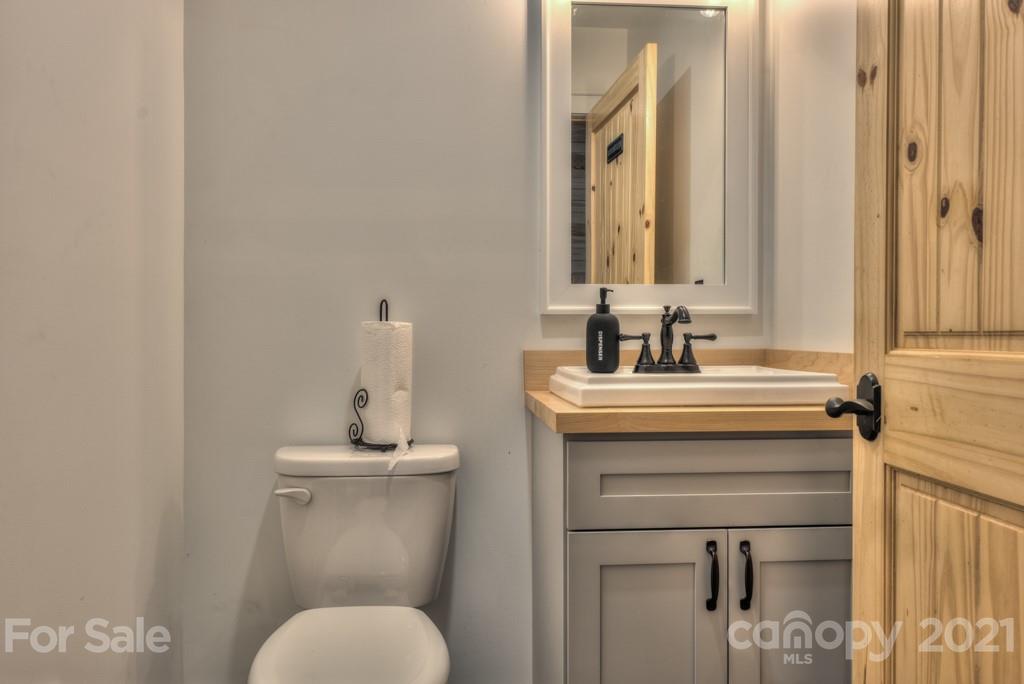 2380 New House Road Ellenboro, NC 28040 - Photo 27 of 44 a bathroom with a toilet sink and mirror