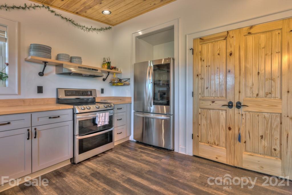 2380 New House Road Ellenboro, NC 28040 - Photo 41 of 44 a kitchen with stainless steel appliances granite countertop a refrigerator and a stove top oven