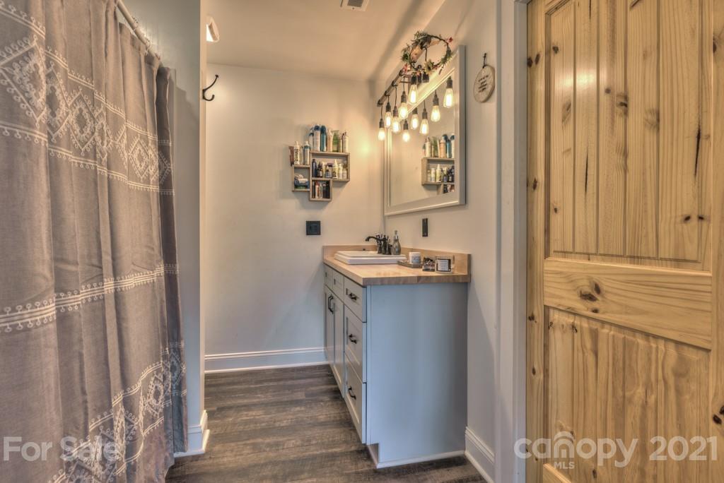 2380 New House Road Ellenboro, NC 28040 - Photo 44 of 44 a bathroom with a sink and a mirror