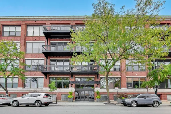 a view of a cars parked in front of a building