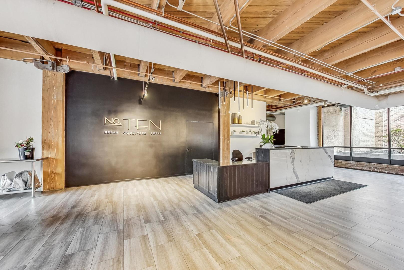 1040 West Adams Street, Unit 370 Chicago, IL 60607 - Photo 18 of 27 a view of a living room with a wooden floors