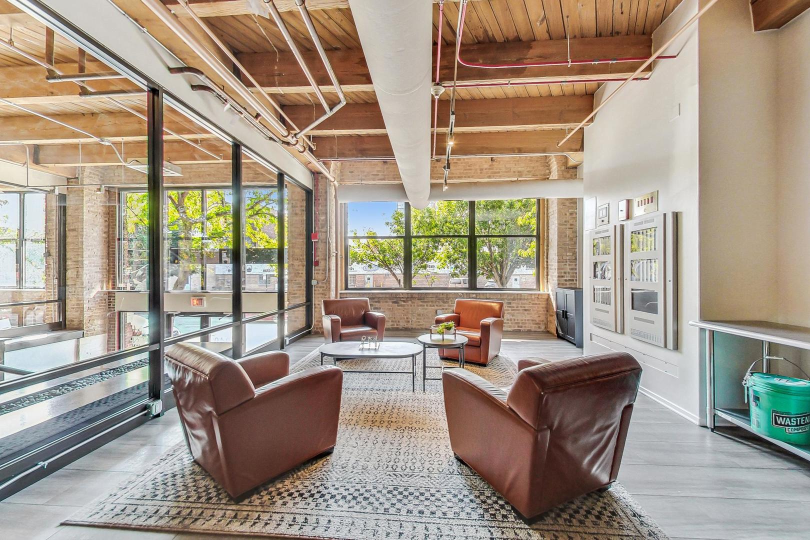 1040 West Adams Street, Unit 370 Chicago, IL 60607 - Photo 19 of 27 a living room with furniture and a large window
