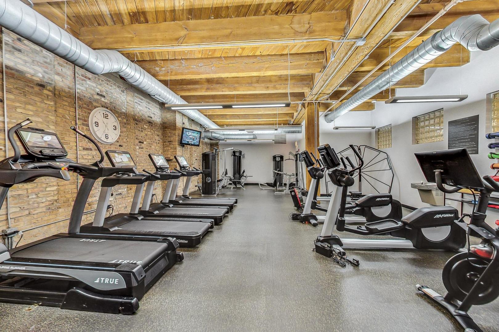 1040 West Adams Street, Unit 370 Chicago, IL 60607 - Photo 20 of 27 a view of a room with gym equipment
