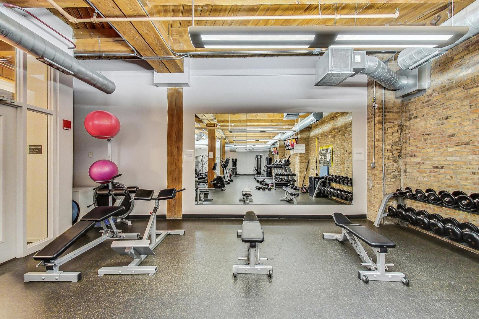 1040 West Adams Street, Unit 370 Chicago, IL 60607 - Photo 21 of 27 a view of a room with gym equipment