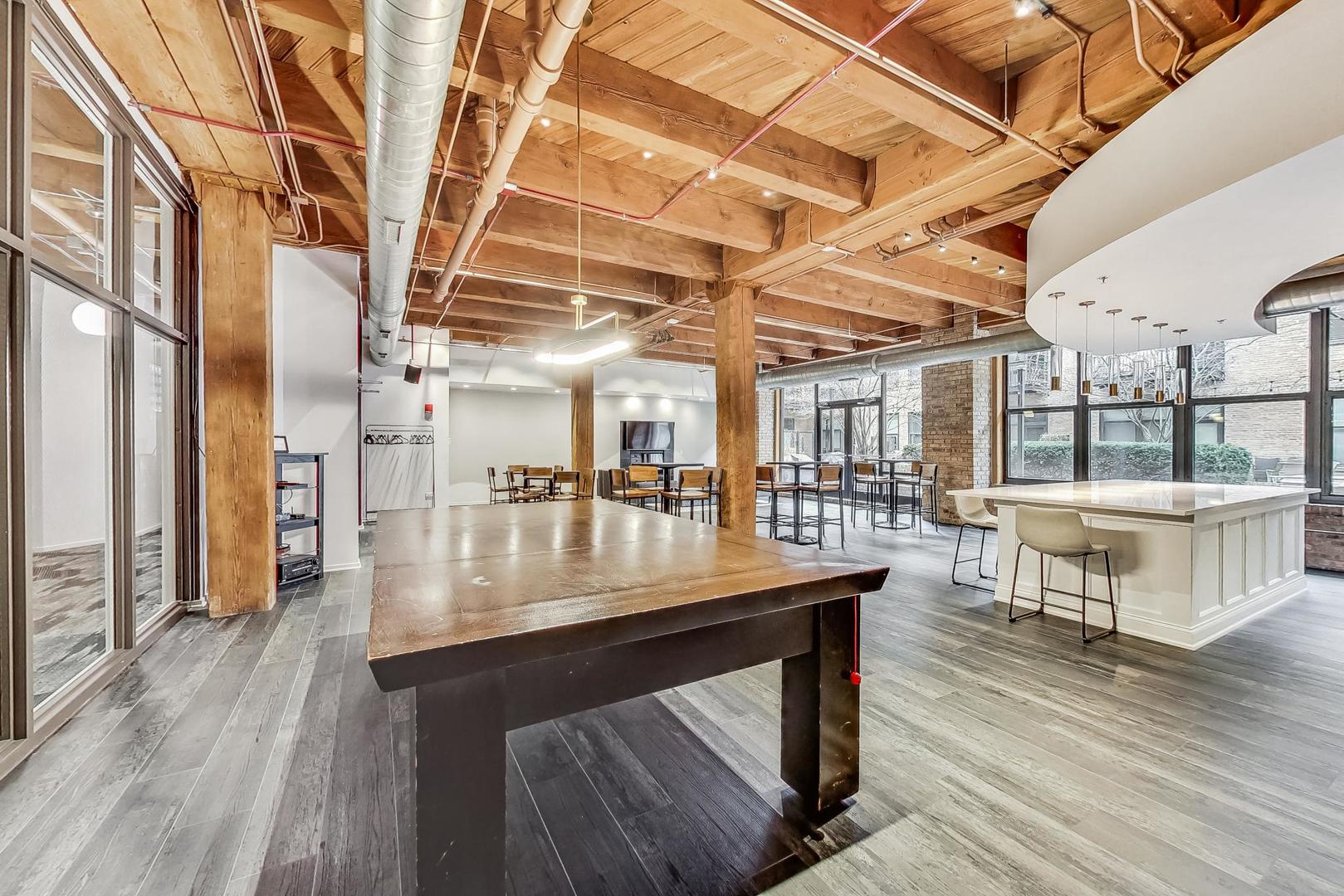 1040 West Adams Street, Unit 370 Chicago, IL 60607 - Photo 23 of 27 a view of a room with wooden floor