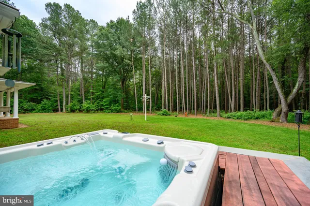 a living room with furniture ceiling fan and a fireplace
