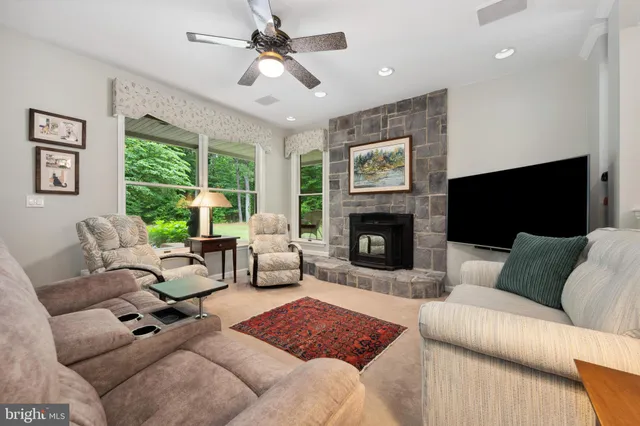 a kitchen with kitchen island granite countertop wooden floors and stainless steel appliances