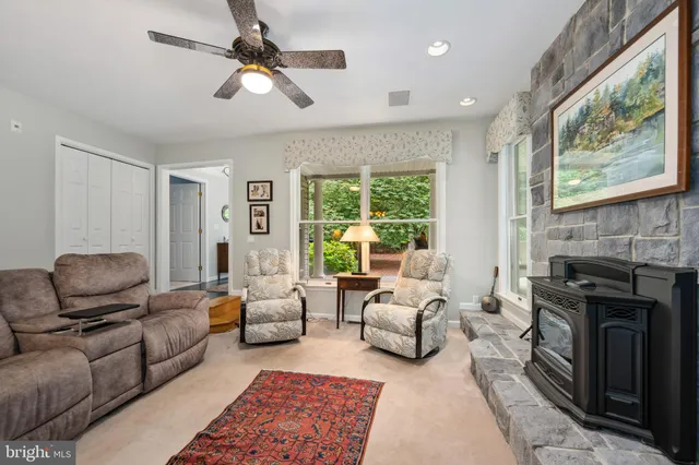 a kitchen with a stove sink and cabinets