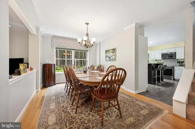 a bathroom with a sink a toilet a mirror and shower
