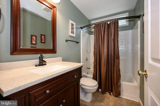 a room with a couch and a window