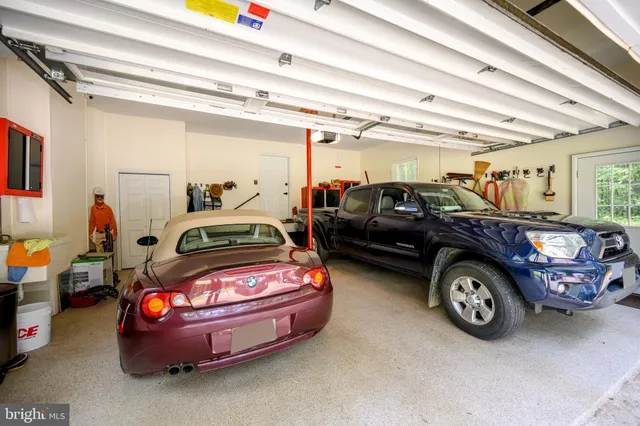 an aerial view of a houses with a lake view