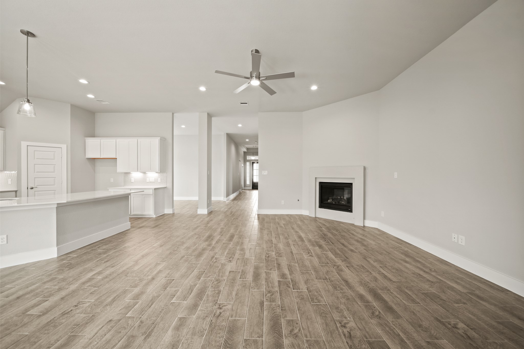 408 Inner Cove Lane Waller, TX 77484 - Photo 12 of 48 an empty room with wooden floor and windows