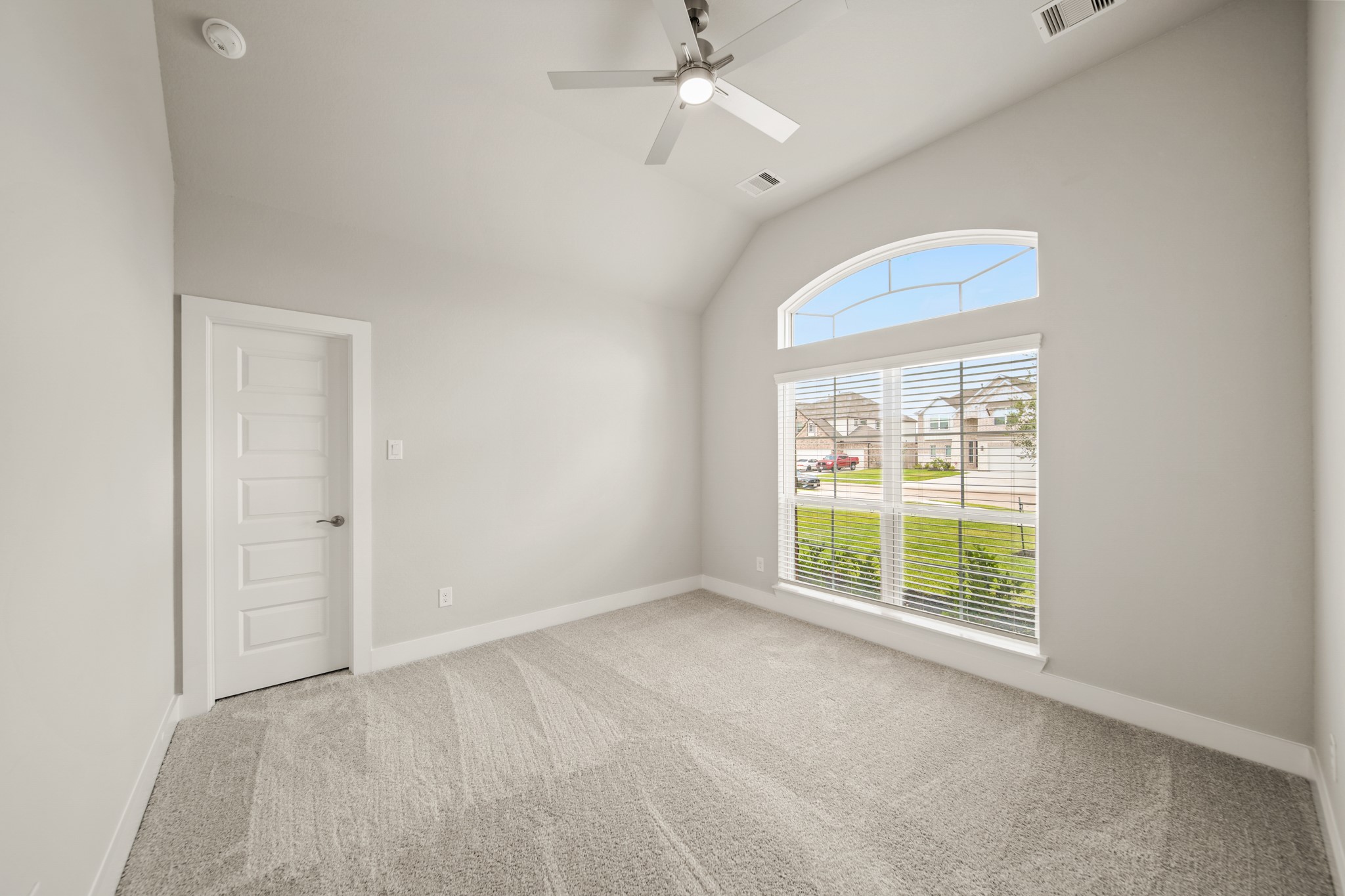 408 Inner Cove Lane Waller, TX 77484 - Photo 19 of 48 an empty room with a fan & a window