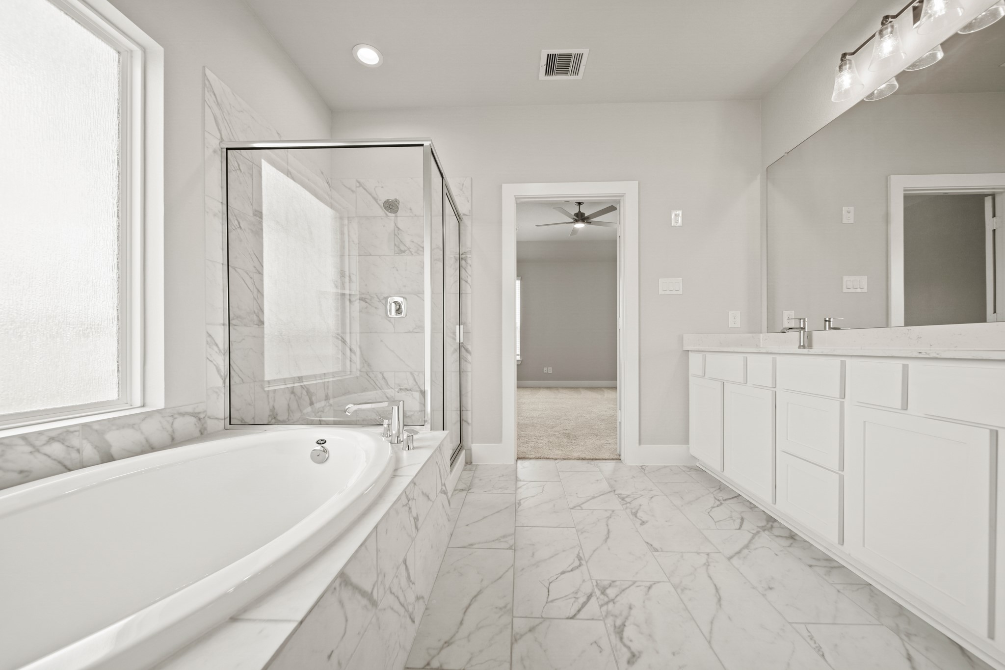 408 Inner Cove Lane Waller, TX 77484 - Photo 23 of 48 a bathroom with a bathtub and a shower