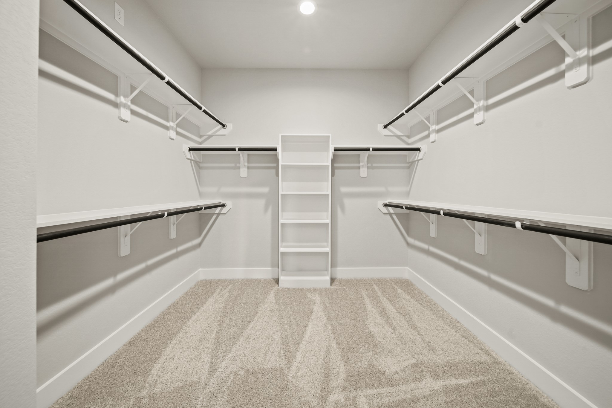 408 Inner Cove Lane Waller, TX 77484 - Photo 24 of 48 a view of walk in closet with empty racks