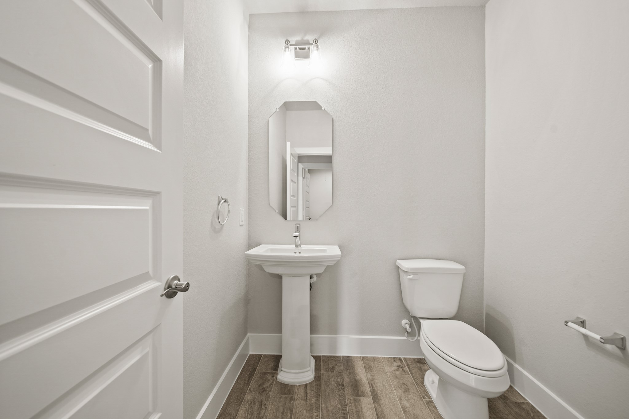 408 Inner Cove Lane Waller, TX 77484 - Photo 25 of 48 a bathroom with a toilet a sink and mirror