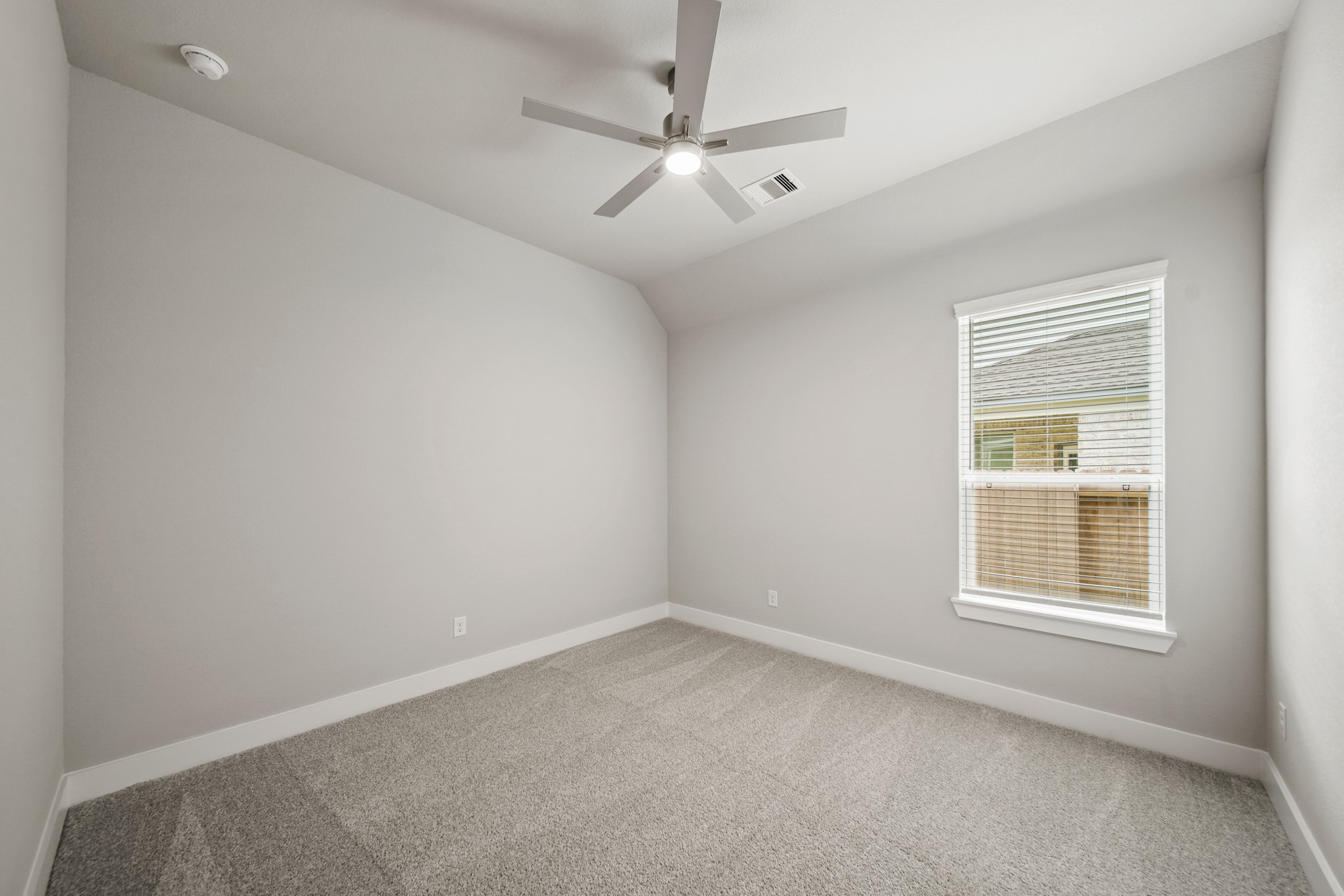 408 Inner Cove Lane Waller, TX 77484 - Photo 27 of 48 an empty room with windows and ceiling fan