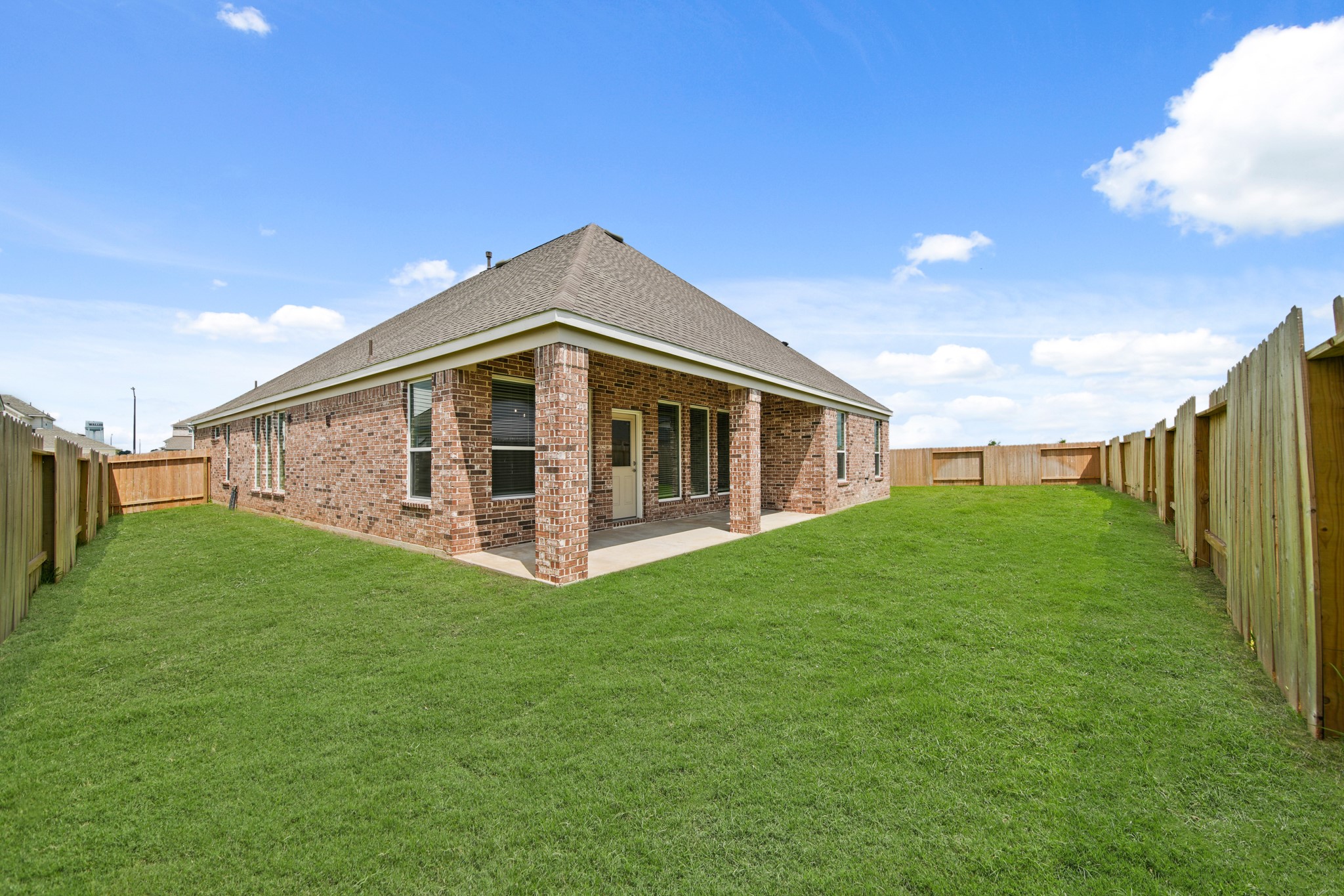 408 Inner Cove Lane Waller, TX 77484 - Photo 32 of 48 a big house with a big yard and more large trees