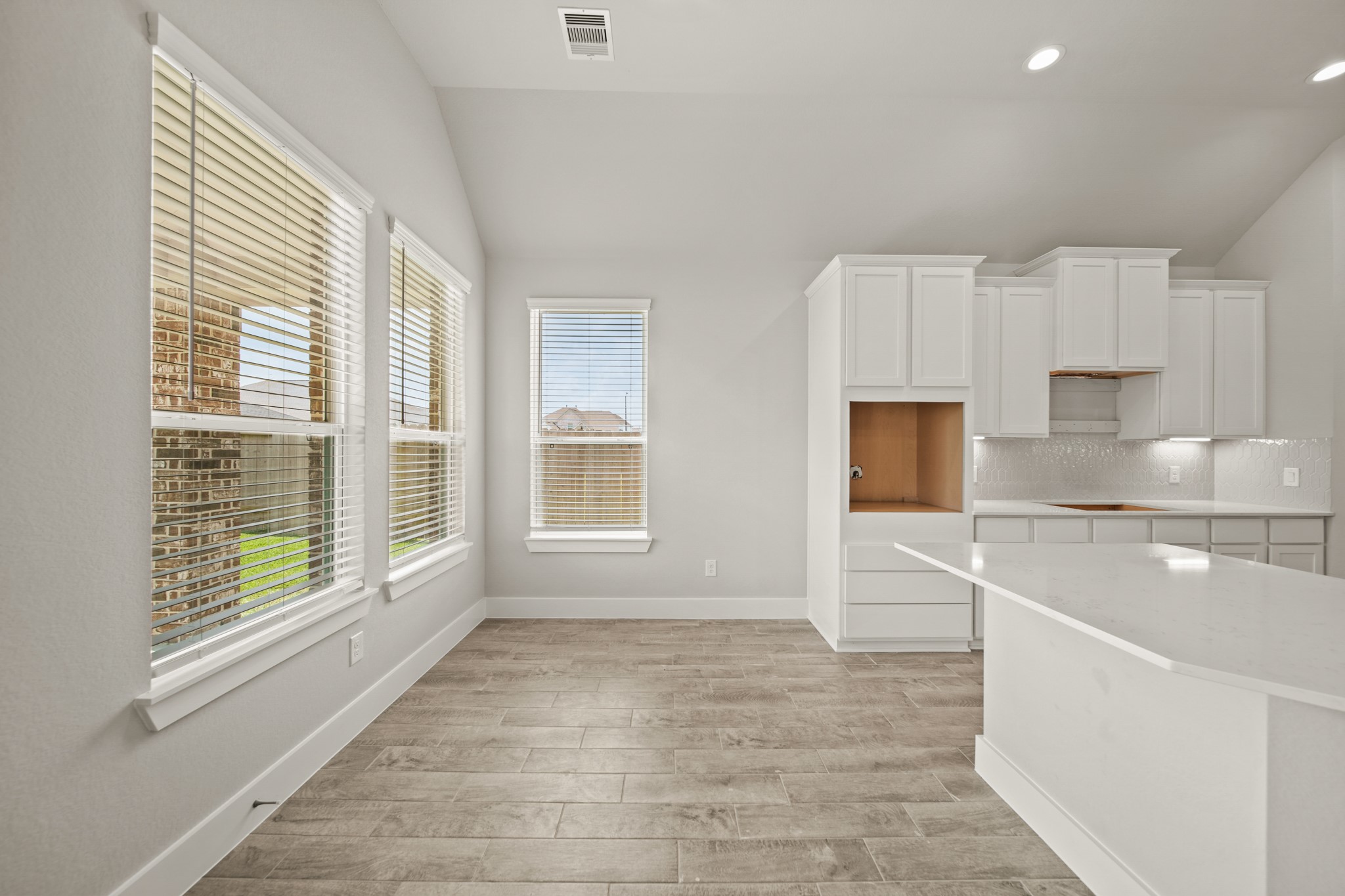 408 Inner Cove Lane Waller, TX 77484 - Photo 9 of 48 a view of a kitchen with a sink and cabinets