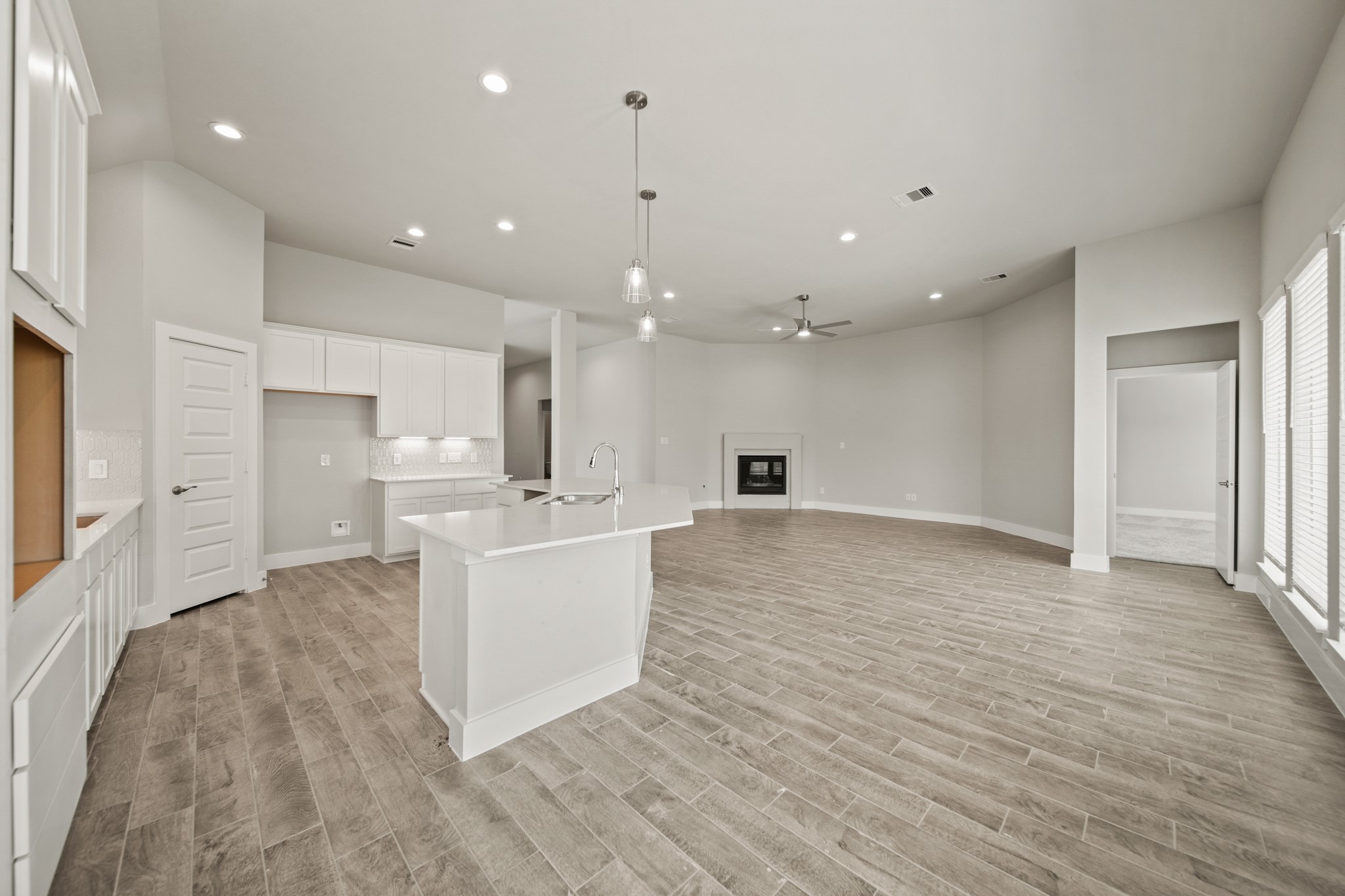 408 Inner Cove Lane Waller, TX 77484 - Photo 10 of 48 a living room with kitchen island furniture and a kitchen view