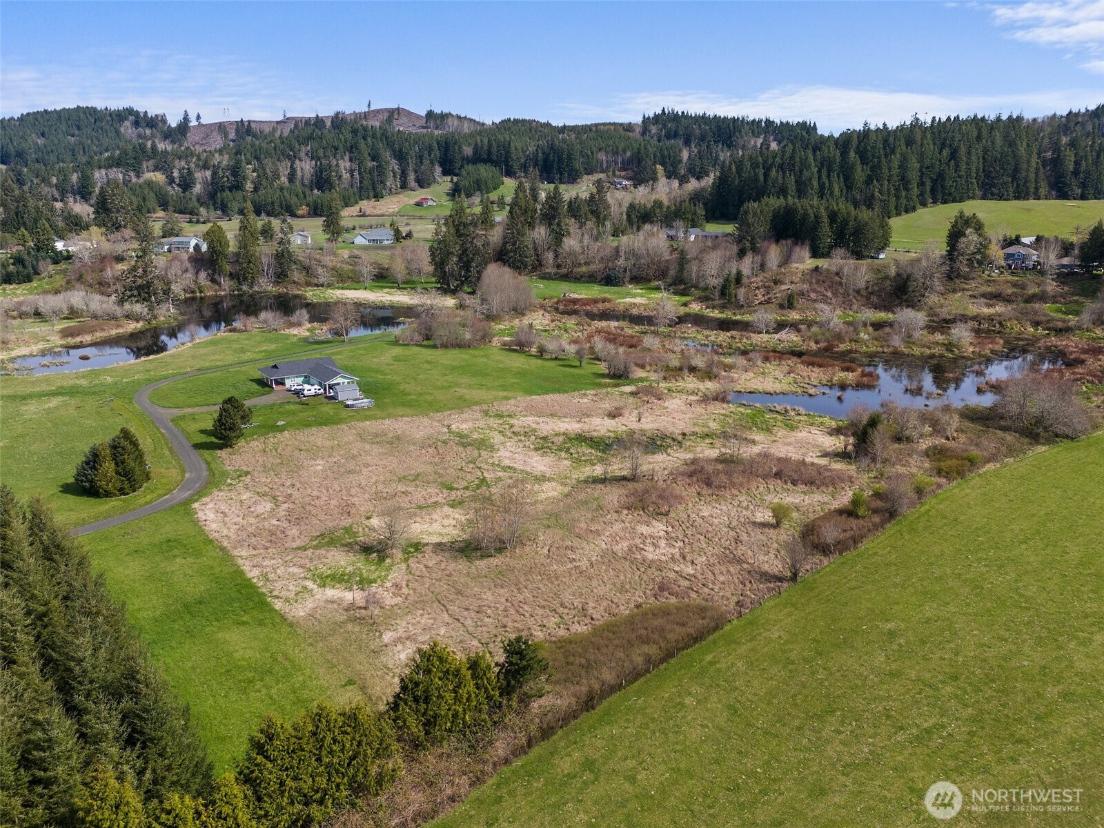 0 X Lilly Wheaton Road Raymond, WA 98577 - Photo 5 of 14 a view of a town with mountains