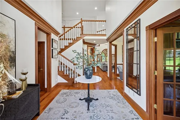 a view of entryway dining room and hall with wooden floor