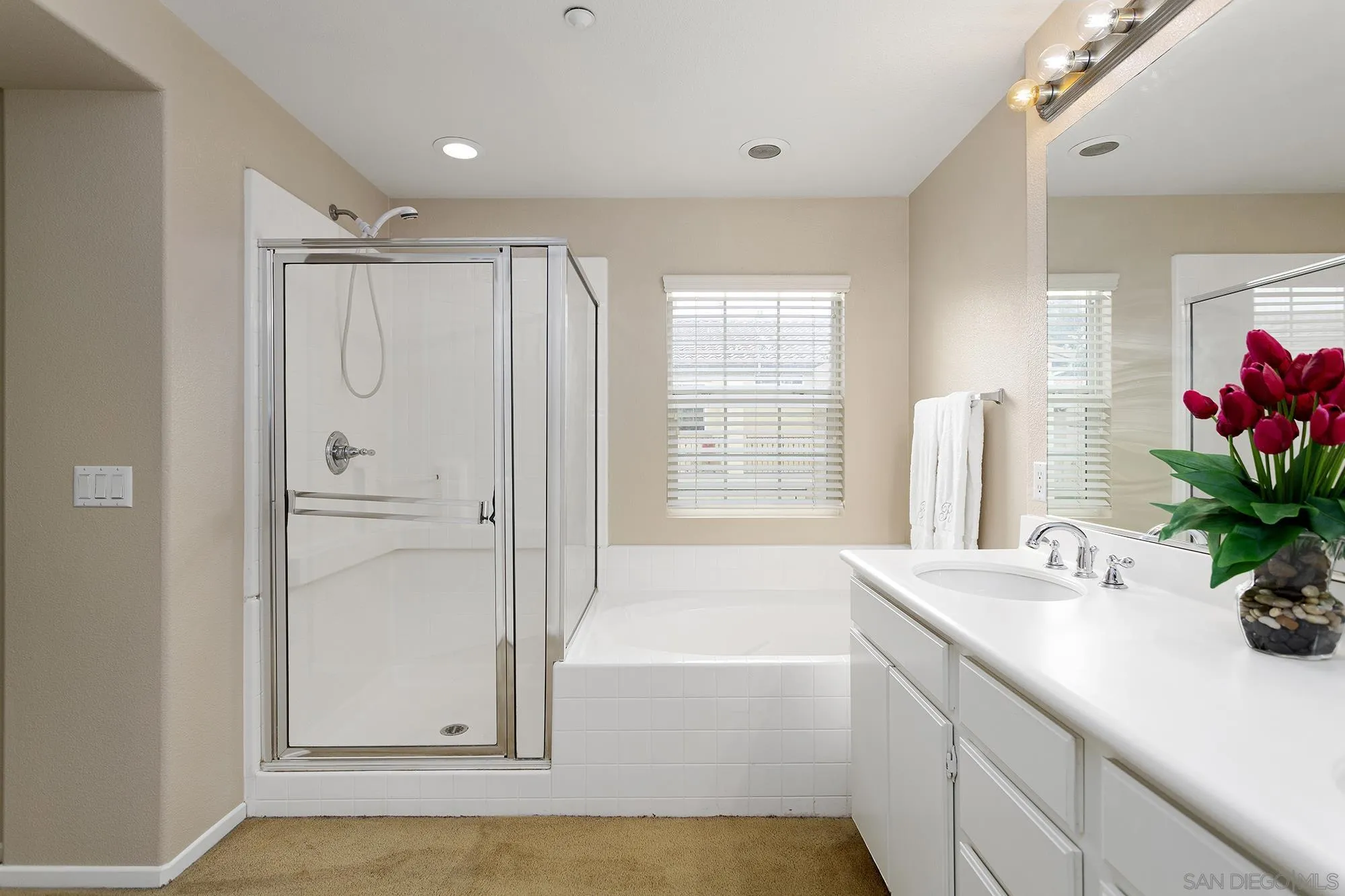 41865 Davenport Way, Unit A Murrieta, CA 92562 - Photo 15 of 26 a bathroom with a tub shower and sink