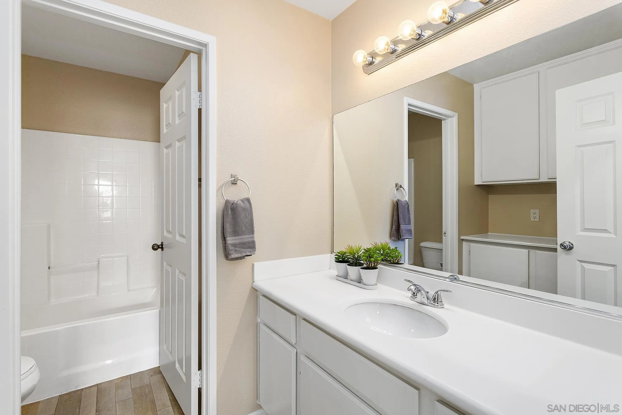 41865 Davenport Way, Unit A Murrieta, CA 92562 - Photo 21 of 26 a bathroom with a tub sink and mirror