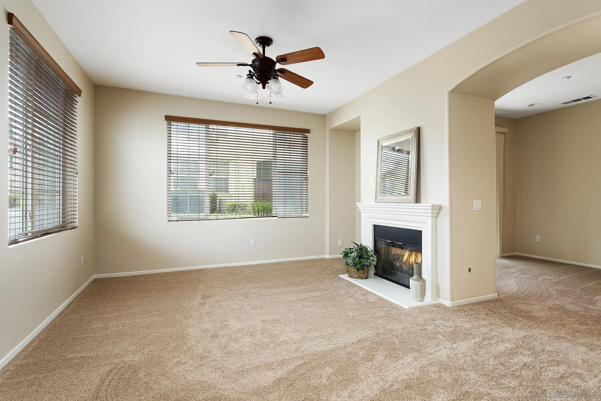 41865 Davenport Way, Unit A Murrieta, CA 92562 - Photo 5 of 26 a view of empty room with fireplace and windows