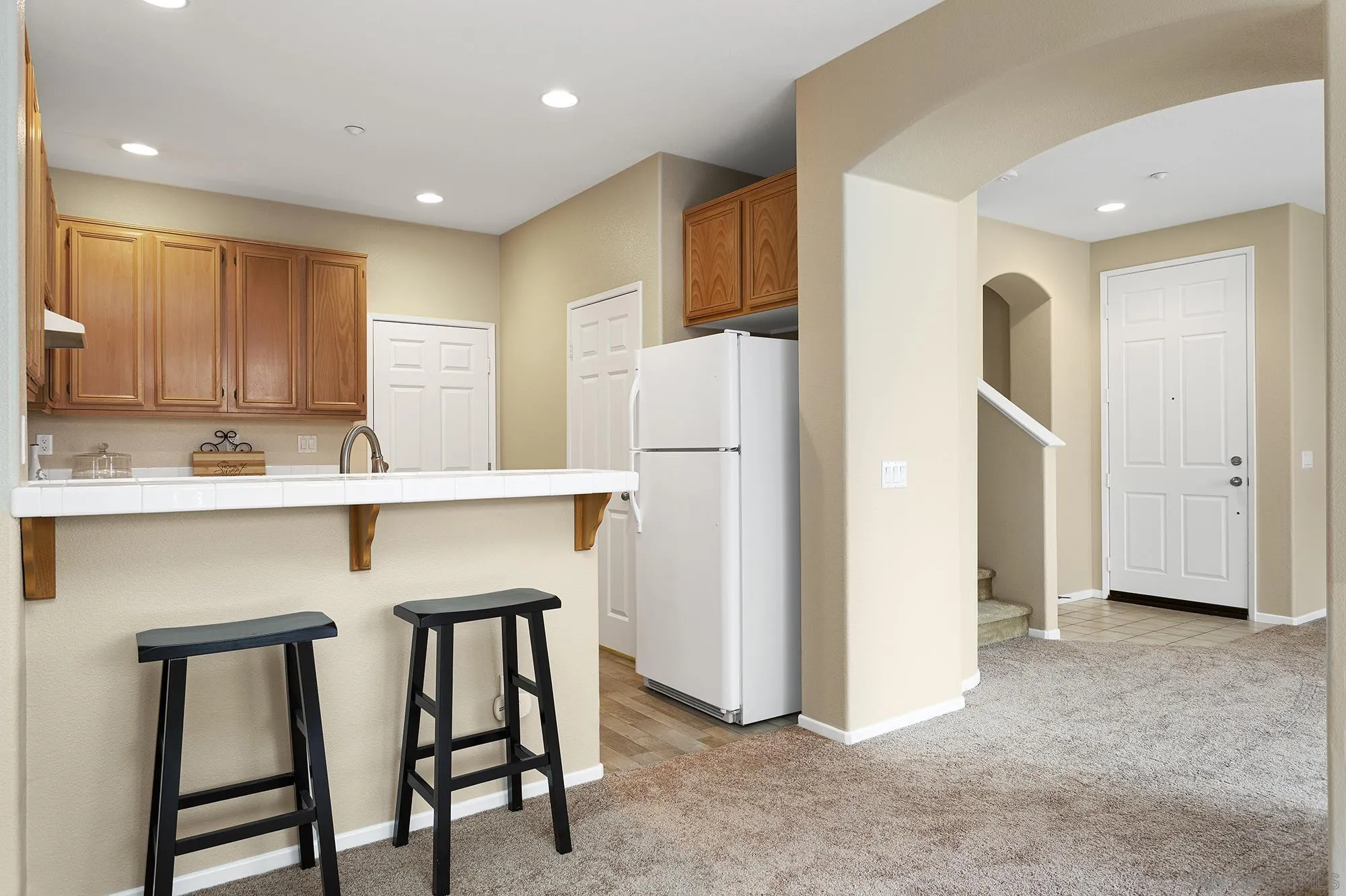 41865 Davenport Way, Unit A Murrieta, CA 92562 - Photo 6 of 26 a kitchen with stainless steel appliances granite countertop a refrigerator a stove a sink and a dining table